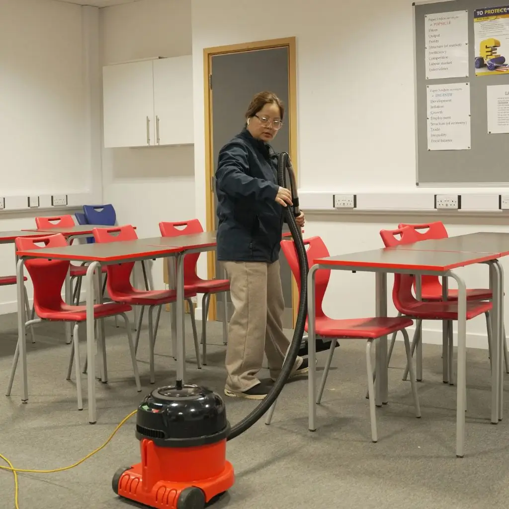 Cleaner working in an education premises in Winchester